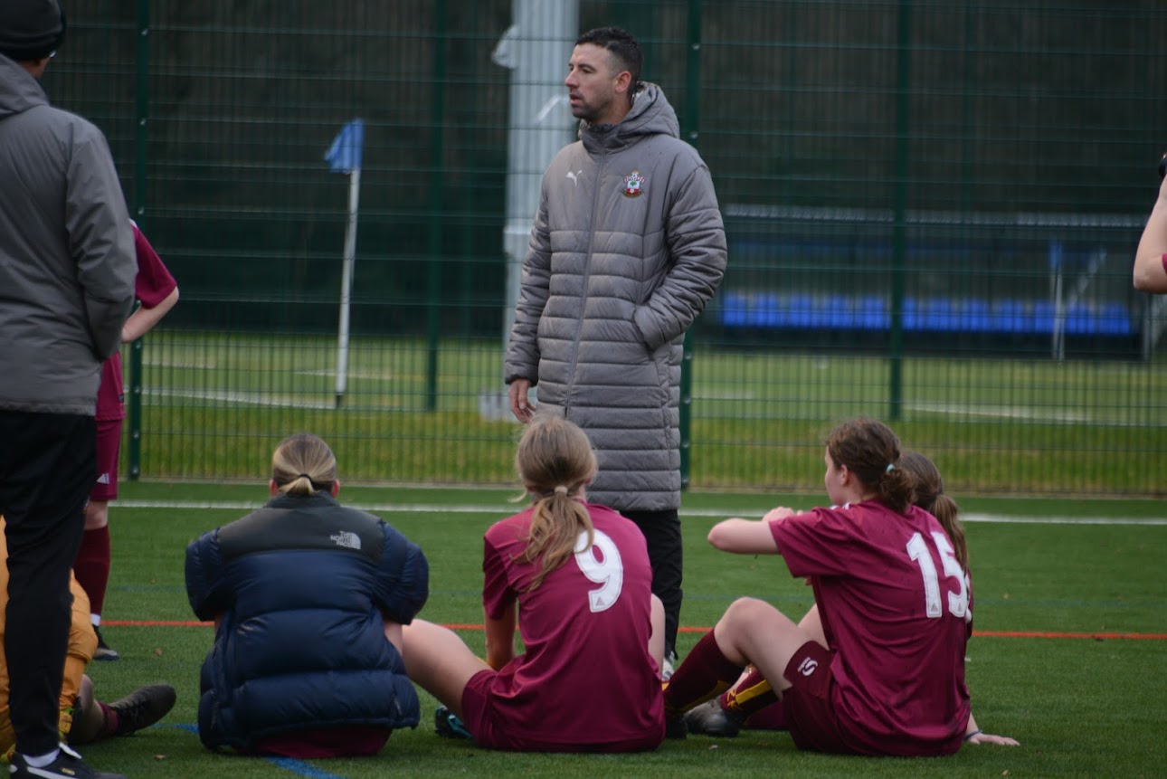 Dave delivering a team talk on the pitch