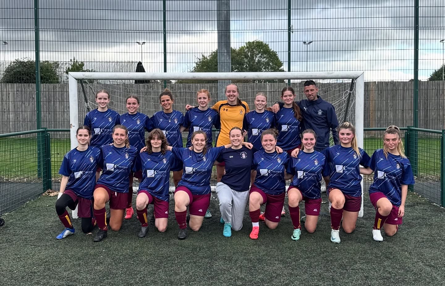 Dave with a women's football squad in front of the goal