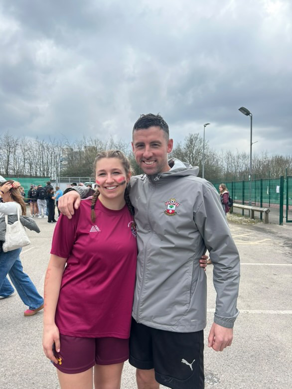Dave Rimmer with a women's football player